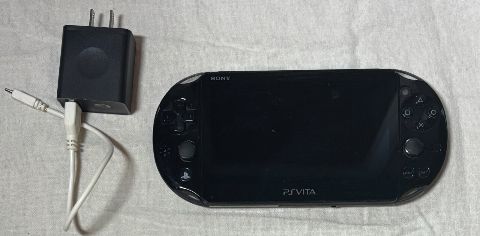 Sony PS Vita (Model: PCH-2001) Slim Handheld Console with compatible charger
